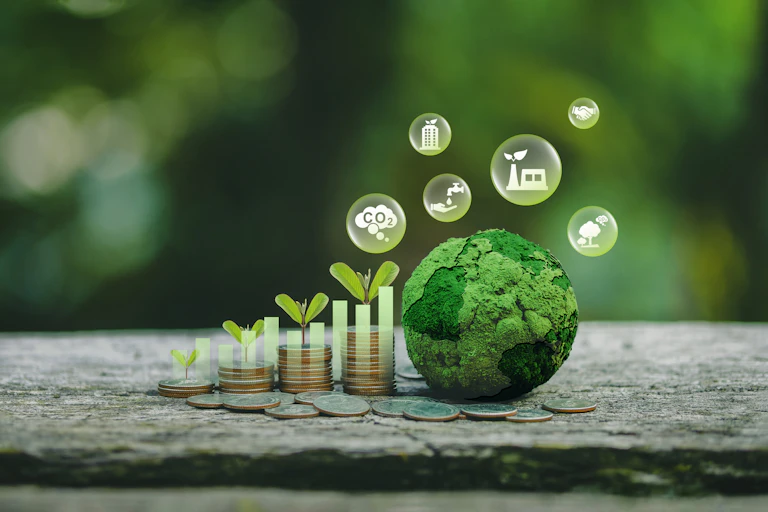 Illustration of coins, green seedlings and a green globe