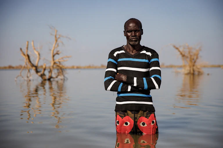 A man stands in water up to his thighs