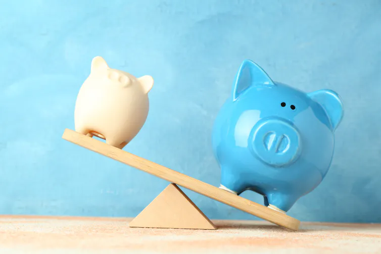 Two piggie **piggy?** banks illustrate ineuqality. On is much bigger than the other.