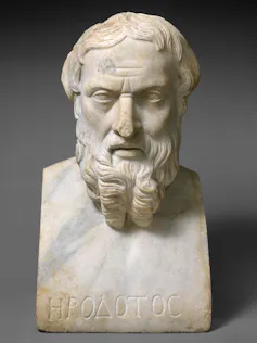 A marble bust of a bearded man with name Herodotus inscribed in Greek at the base