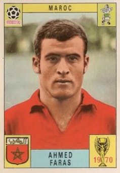 A card marked in each corner with national and football emblems and featuring a portrait of a young man in a red football jersey.