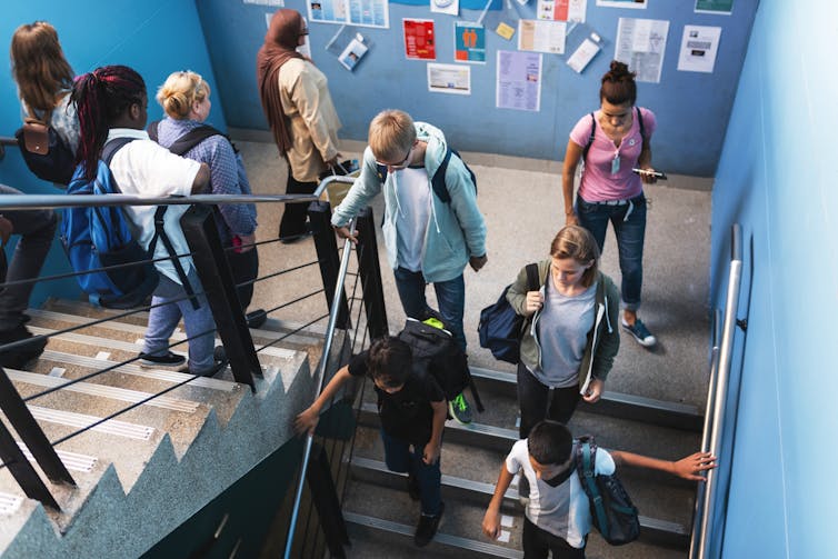 Pupils on stairs at school