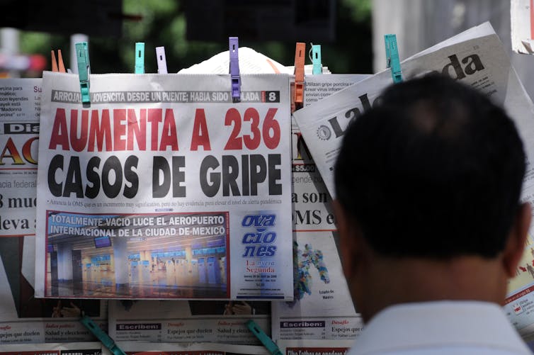 mexican newspaper headline in red font detailing 236 cases of swine flu