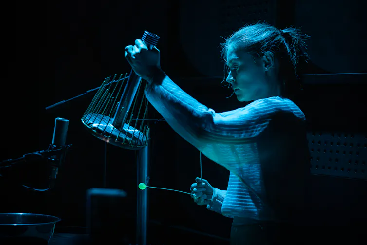 A musician under blue lights.