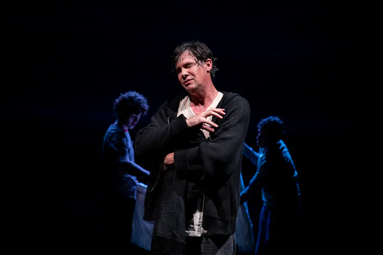 Production photo: Schmitz on stage, in emotional agony.