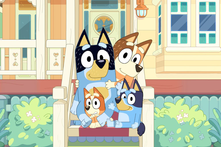 Dad, Mum, Bluey and Bingo on the front steps of their house.