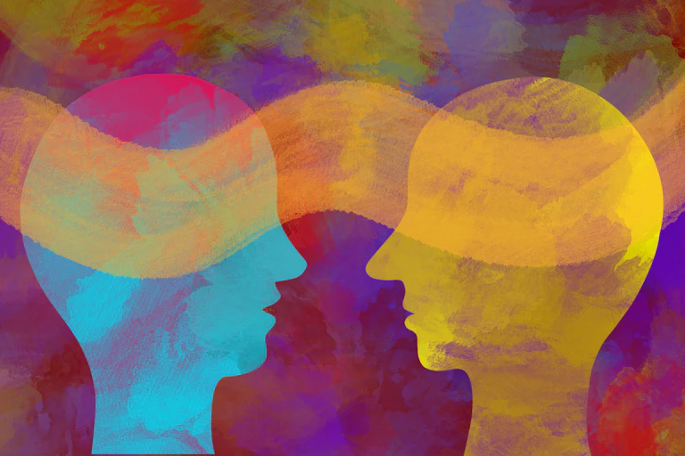 Two heads facing each other, cloud wafting between them