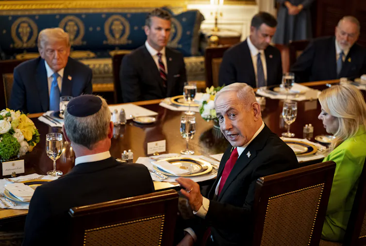 Why Donald Trump has stopped some conflicts but is failing with Ukraine and Gaza 1 Benjamin Netanyahu turns and looks at the camera while sitting at a table in the White House with US president Donald Trump and others.