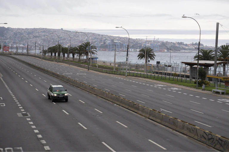 An empty motorway next to the coast.