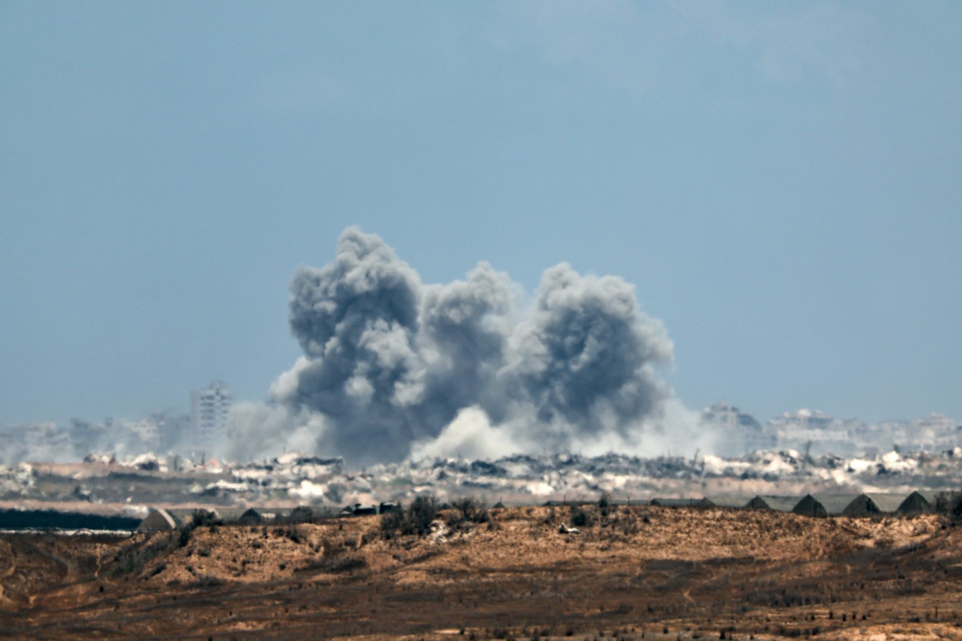 Long-distance view of Israeli airstrikes being conducted against northernm Gaza.