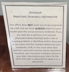 A sign labeled 'Attention: Important insurance information' reads 'Our office does NOT want you to be surprised by a bill, but we must ALWAYS report to your health plan the actual services rendered.'