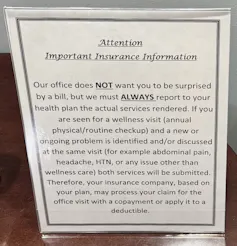 A sign labeled 'Attention: Important insurance information' reads 'Our office does NOT want you to be surprised by a bill, but we must ALWAYS report to your health plan the actual services rendered.'