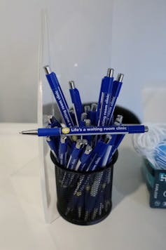 Pens read 'life is a waiting room'.
