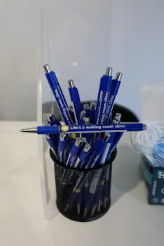 Pens read 'life is a waiting room'.
