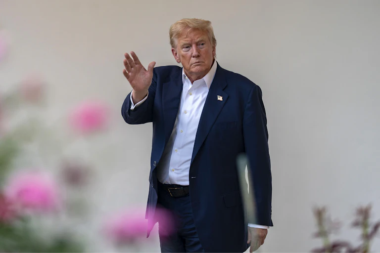 us president donald trump waving to the camera