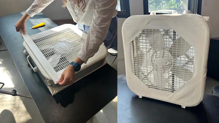 fan blades inside a box with holes for air to pass through held together using duct tape.