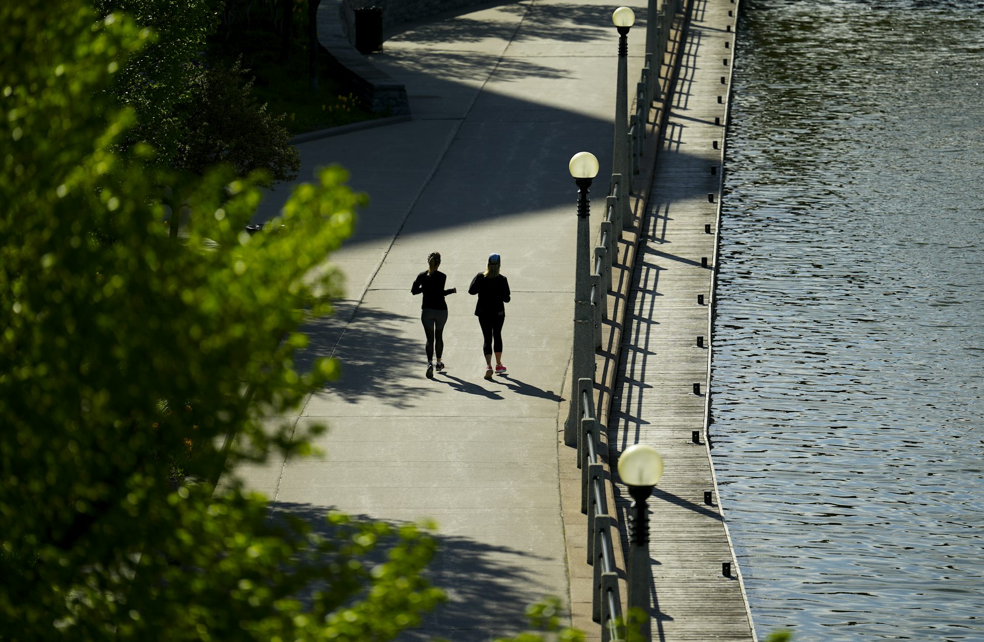 People run alongside the Rideau Canal in downtown Ottawa.