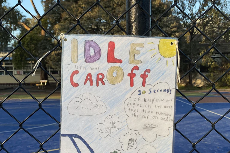 poster against car idling outside schools.