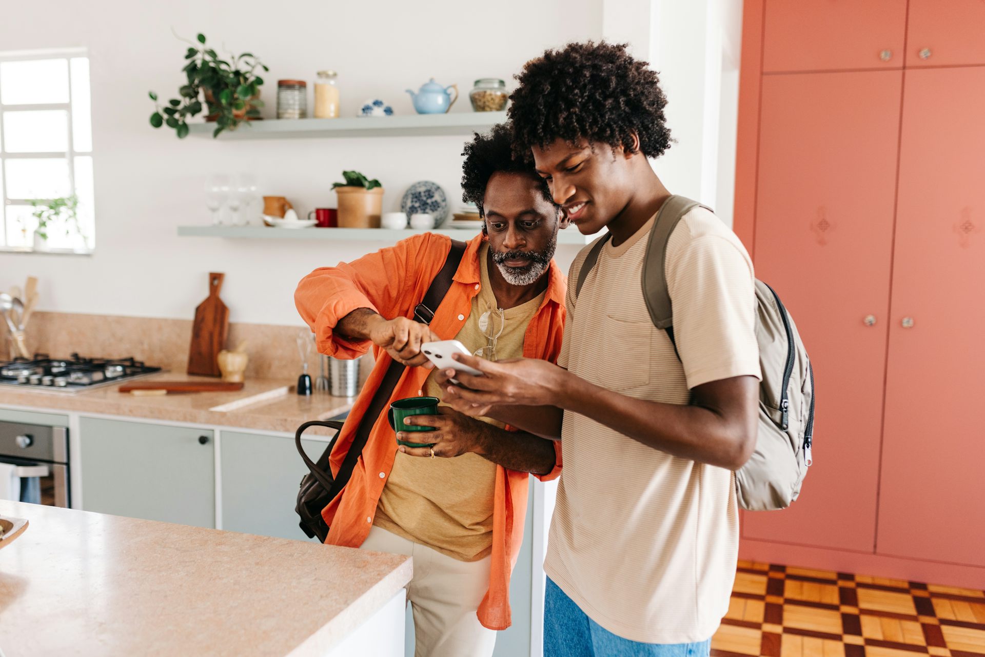Father and son looking at phone