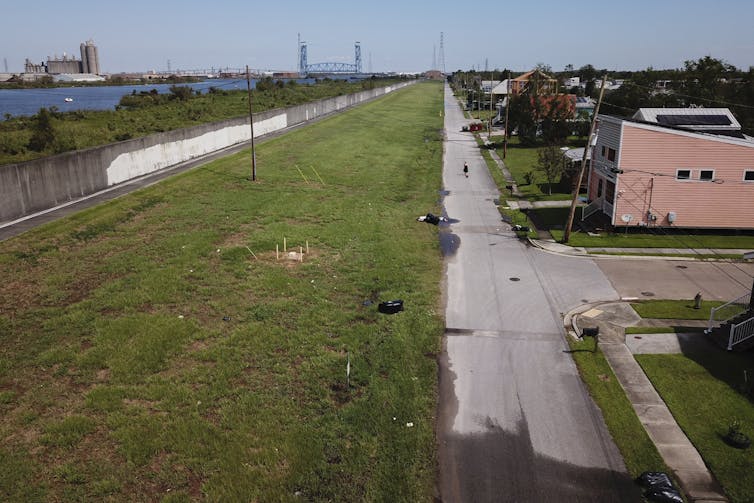 A 2021 photo showing the low-lying neighborhood and the canal just across a flood wall.