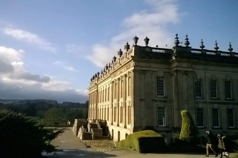 A large rectangular home against a blue sky.