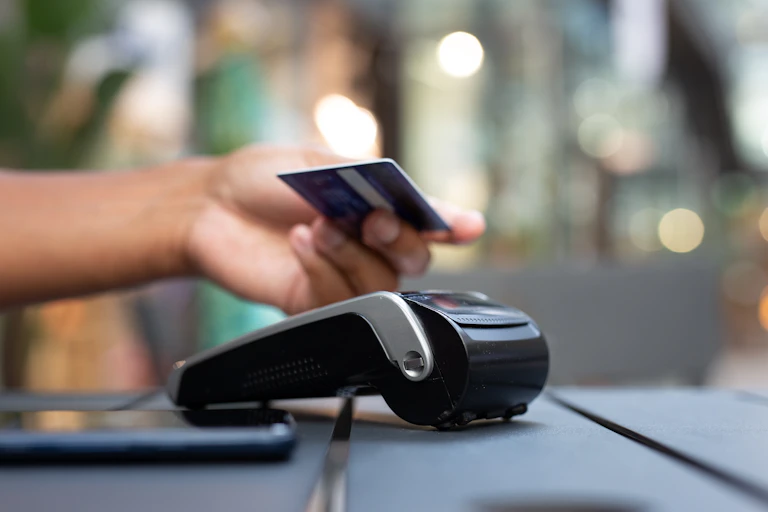Person using contactless payment.