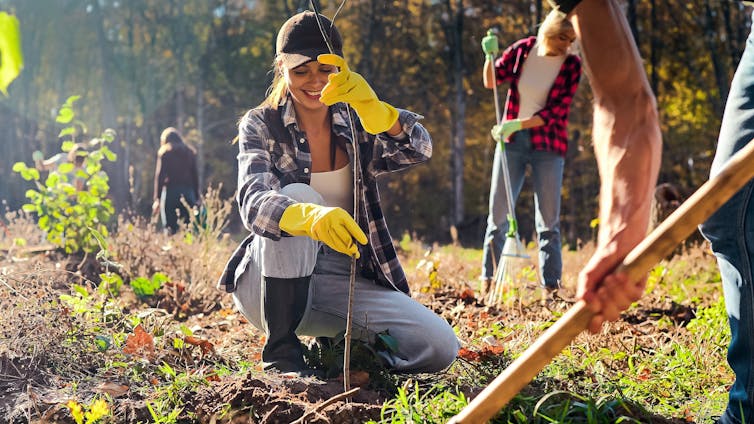 Woman planting tree.