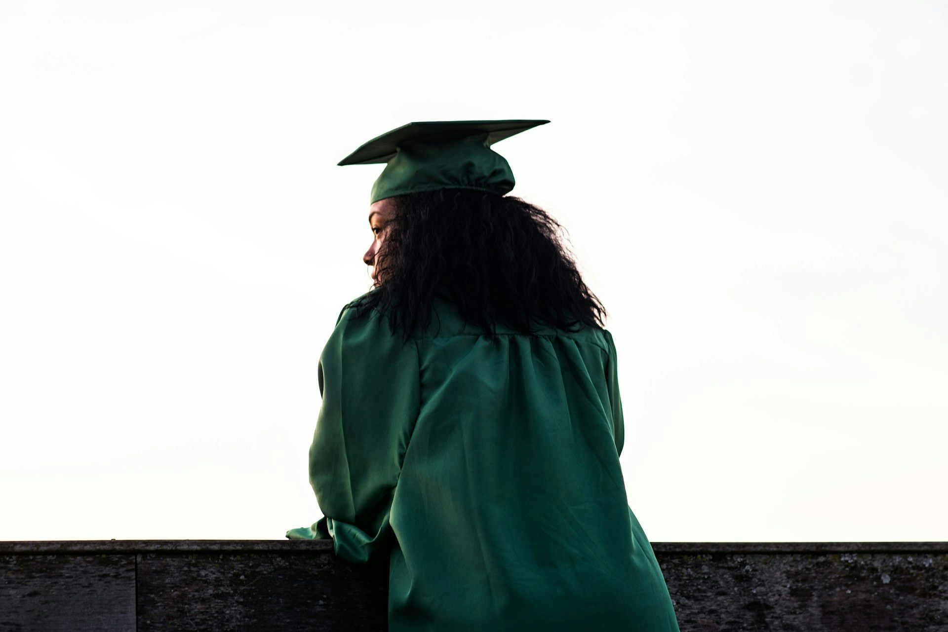 Woman in academic gowns and graduation cap