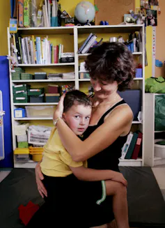 A woman holding a child.