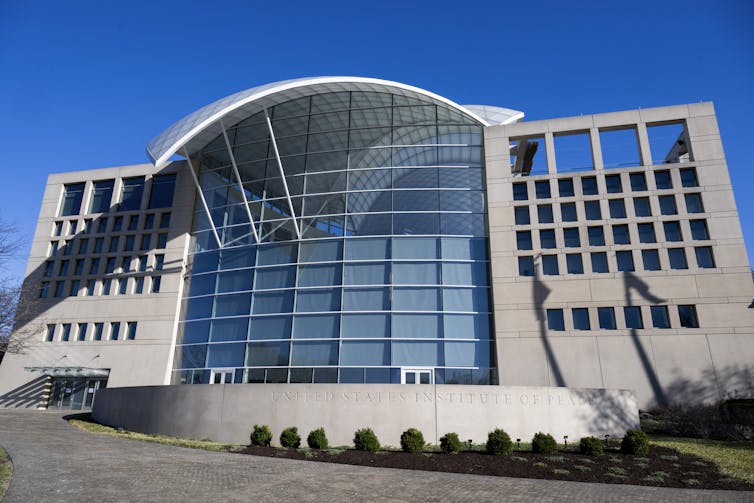 A building with an arched rood and multiple windows.