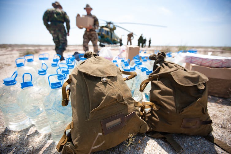 Soldiers delivering humanitarian aid.