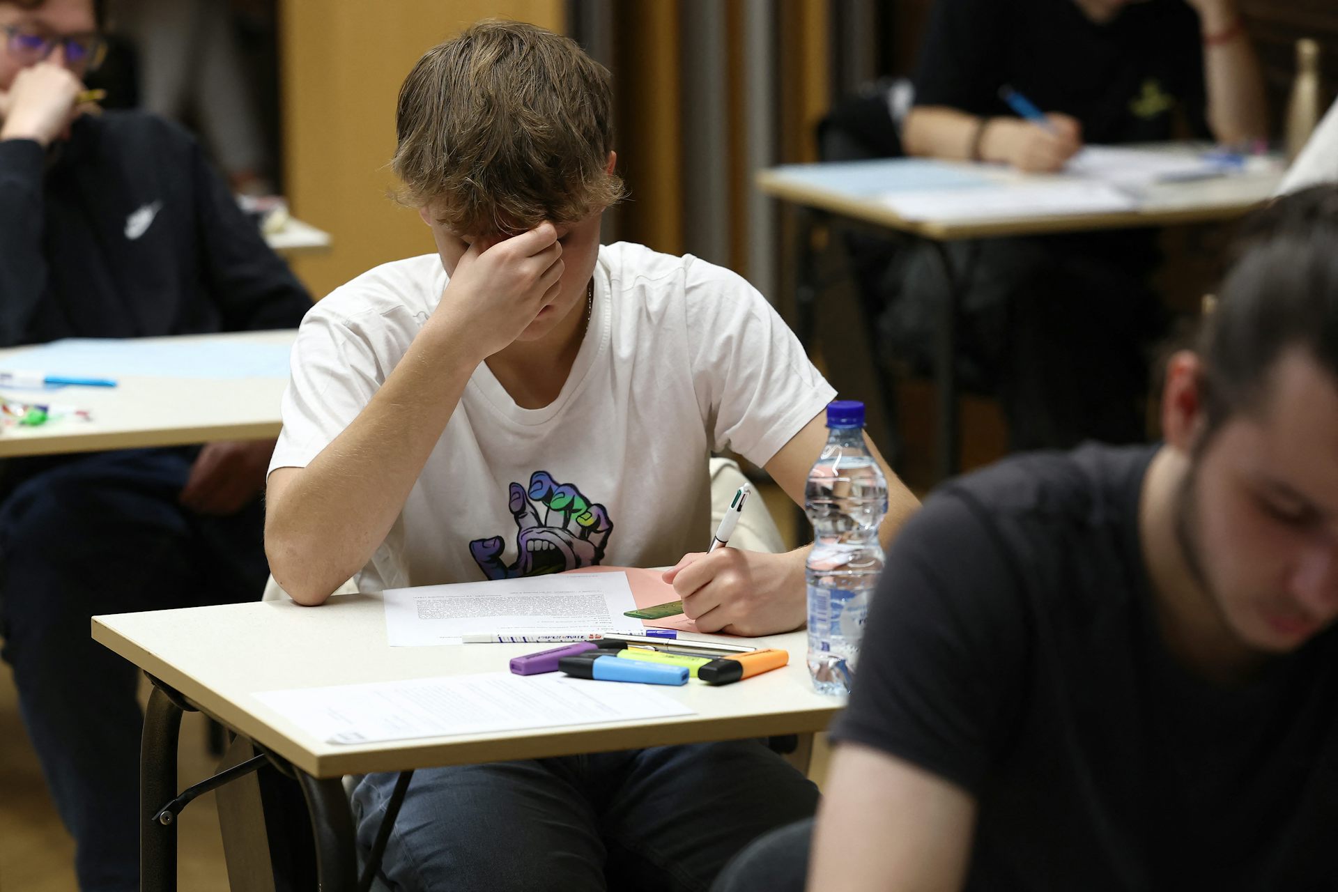 Students taking an exam.
