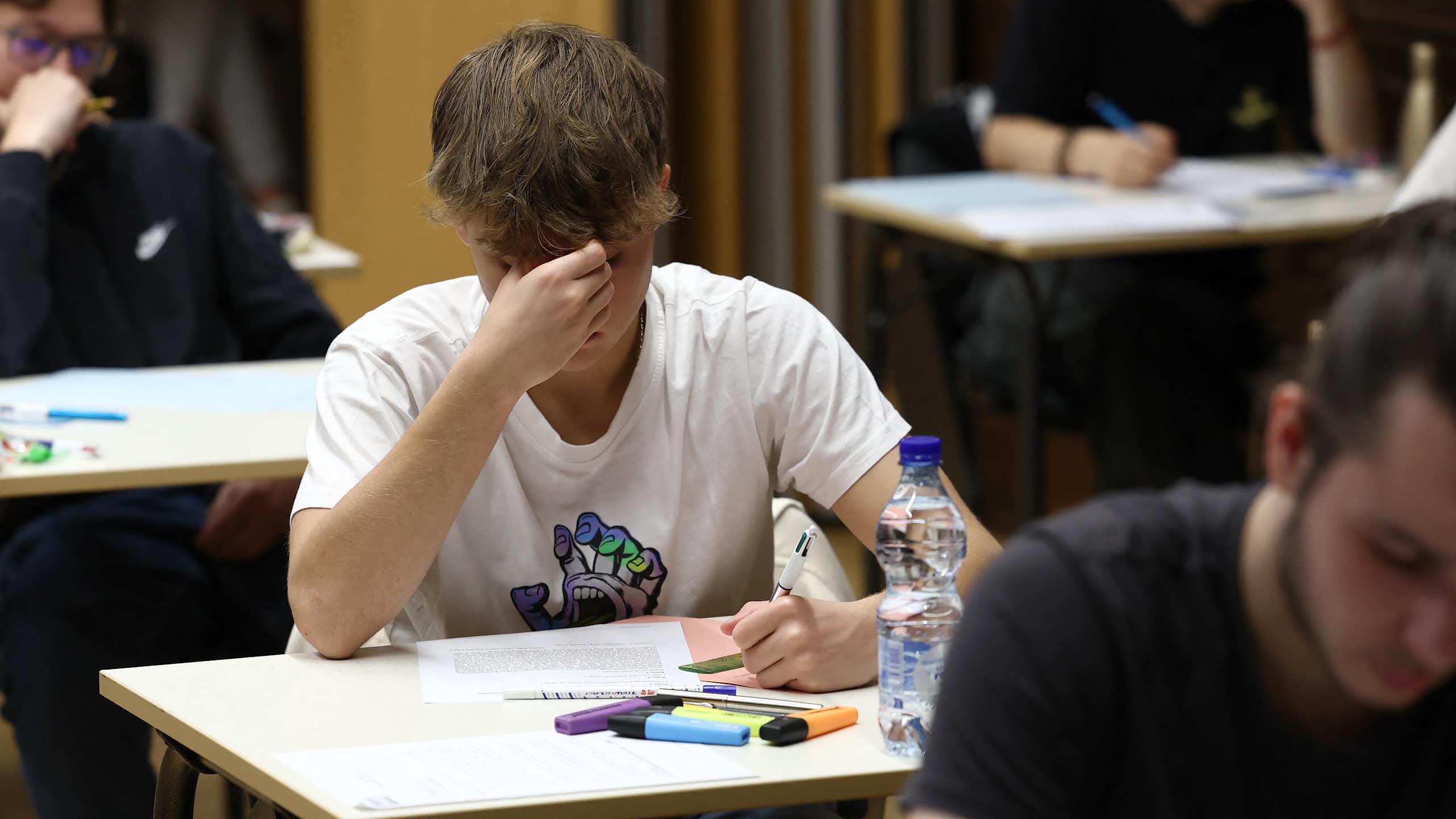 Students taking an exam.