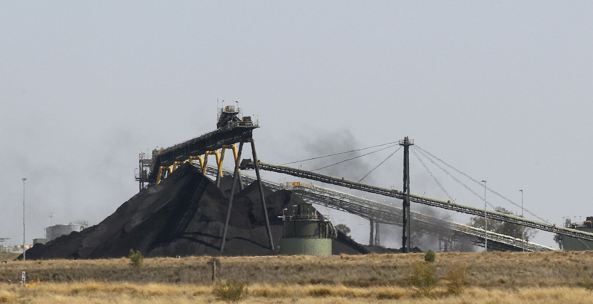 A pile of coal with machinery.