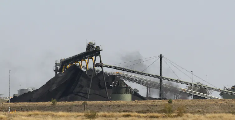 A pile of coal with machinery.
