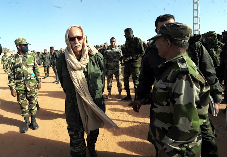 Morocco the usage of financial clout to beef up grip on disputed Western Sahara territory 1 Brahim Ghali surrounded by people in military clothing.