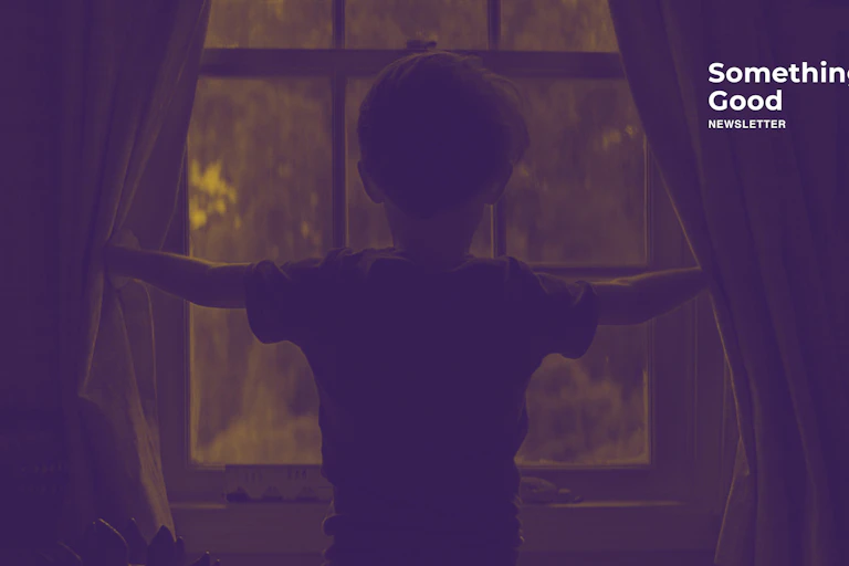 Boy stares out of window