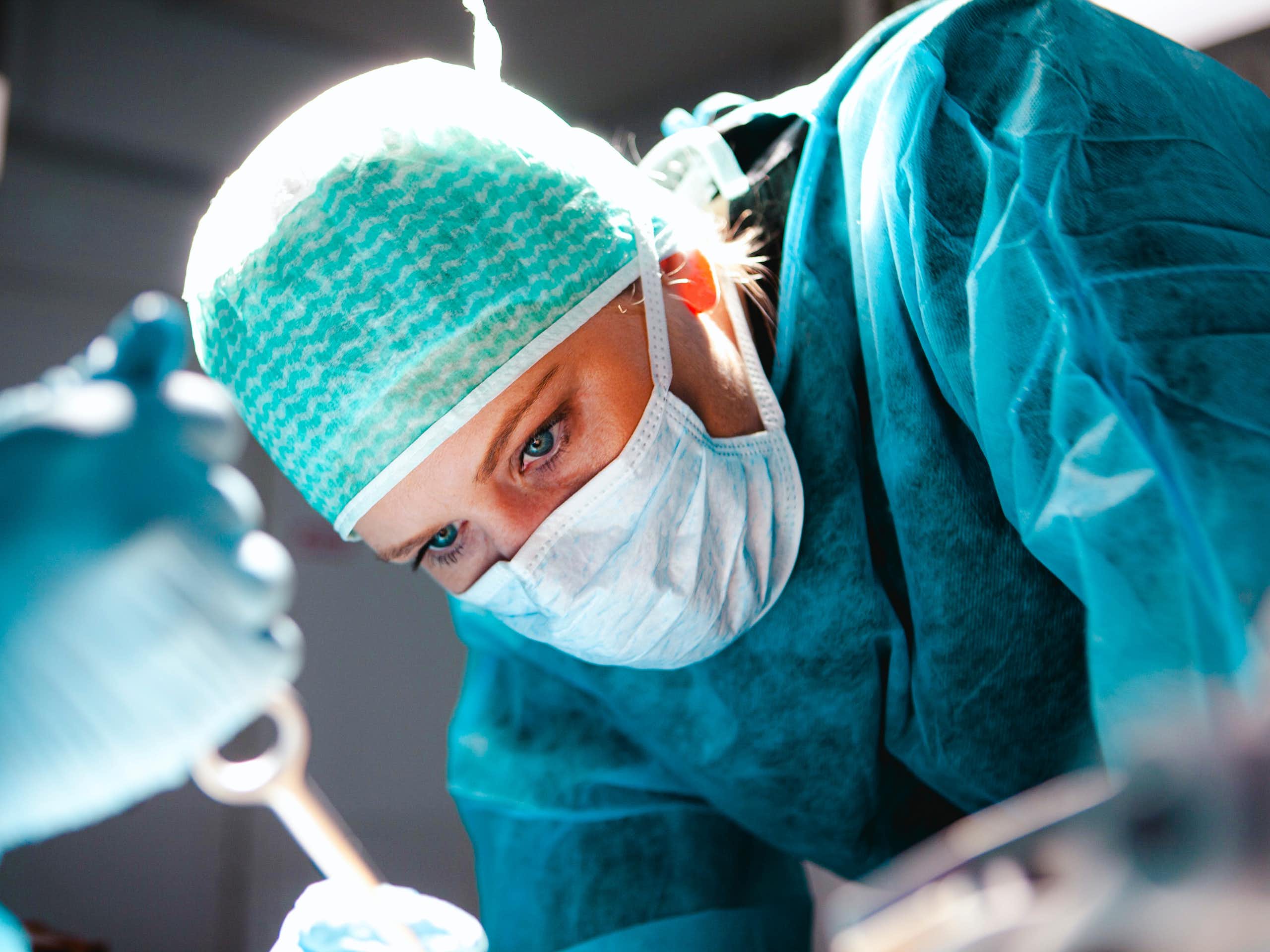 Close up of woman surgeon's head during operation