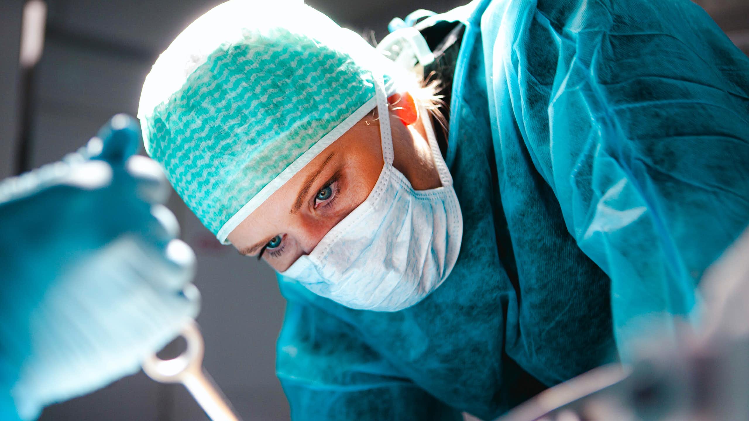 Close up of woman surgeon's head during operation