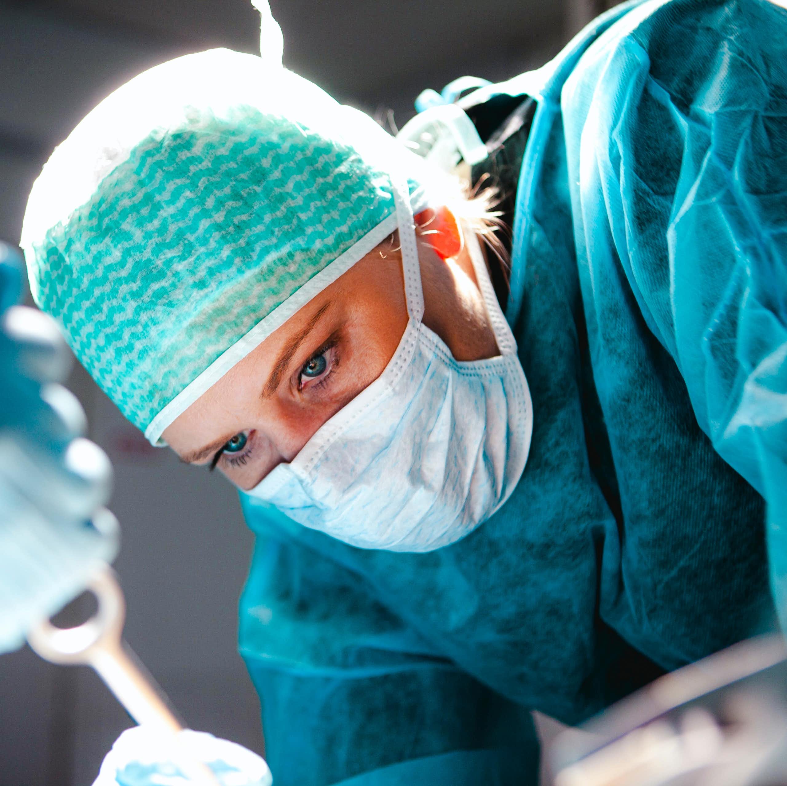 Close up of woman surgeon's head during operation