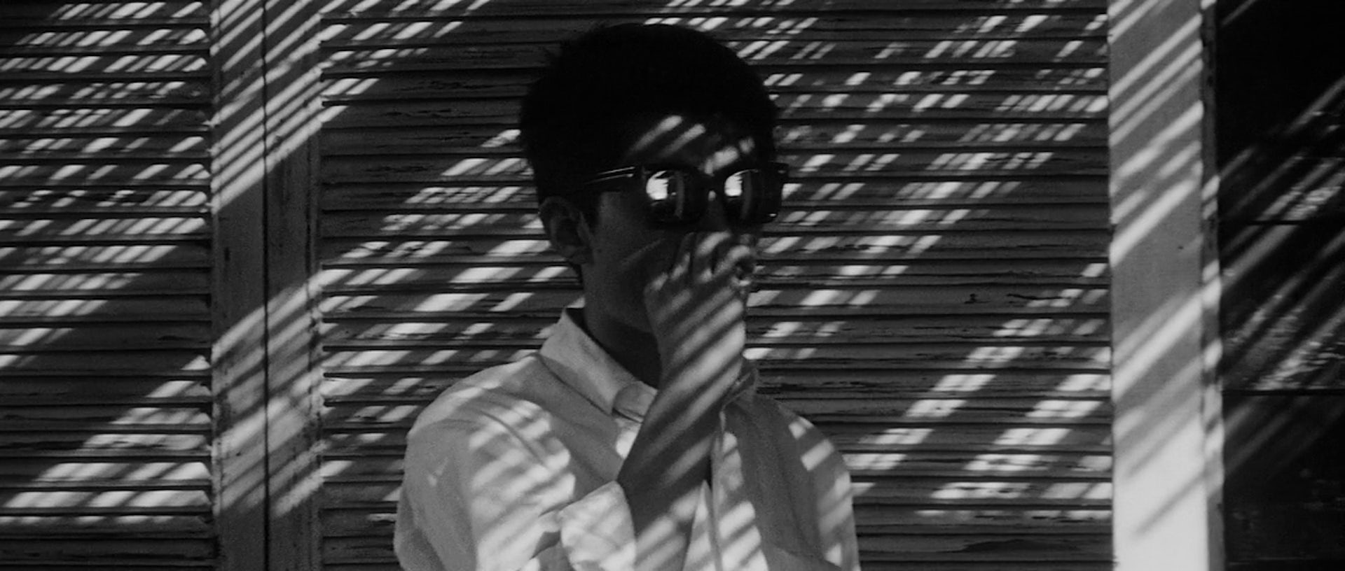 A man half in shadows.