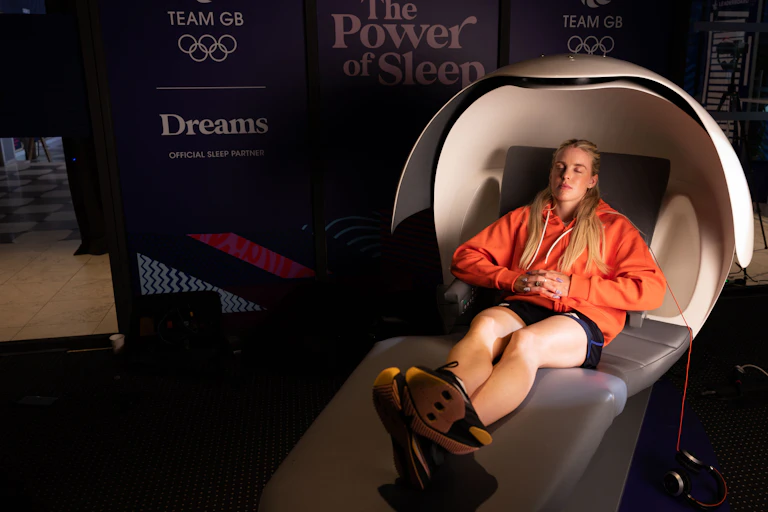 English middle-distance runner Keely Hodgkinson tries to get some sleep in a pod during the 2024 Olympics in Paris.