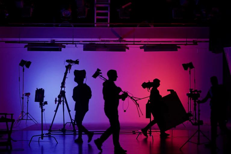 Film set with people working silhouetted