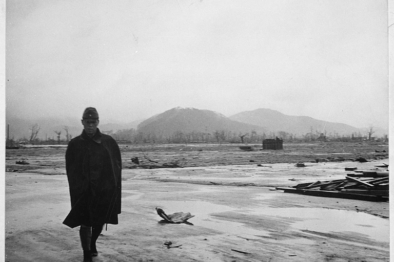 A man standing in the devastated streets of Hiroshima after the atomic bombing on August 6 1945.