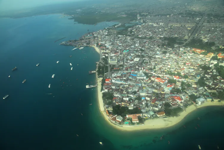 An island outcrop with buildings.