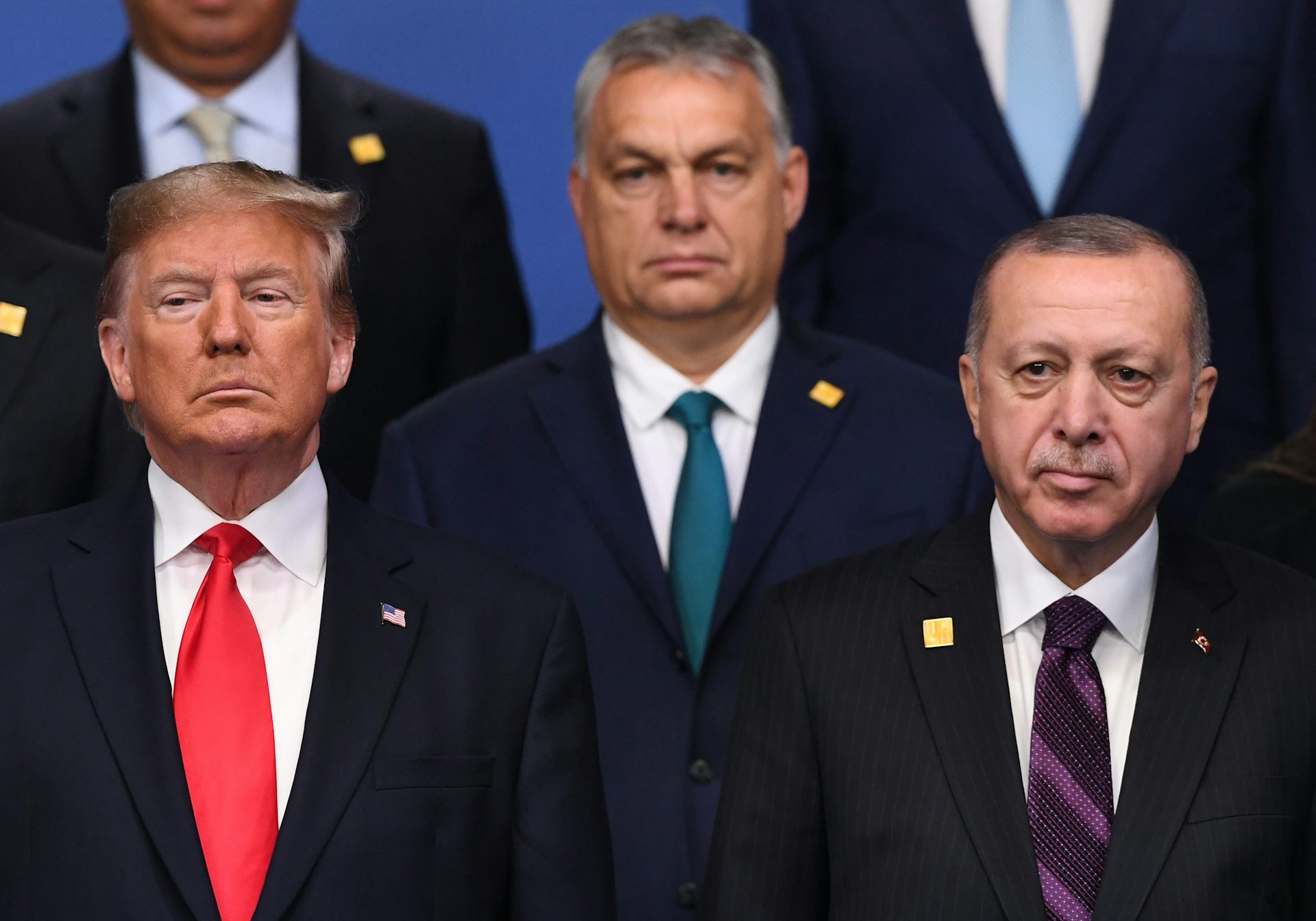 Donald Trump standing alongside Viktor Orbán and Recep Tayyip Erdoğan.