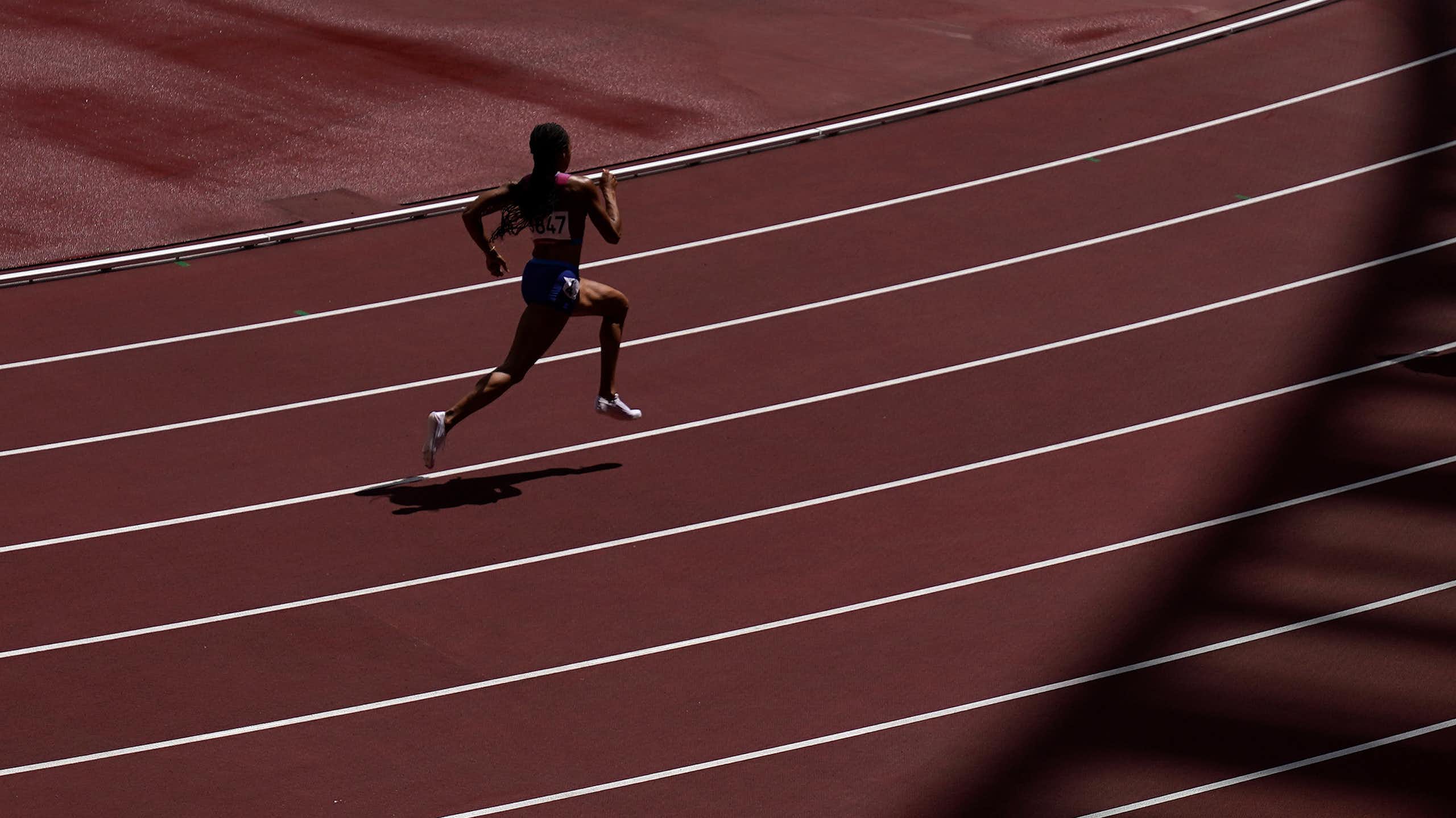 A runner sprinting on a track