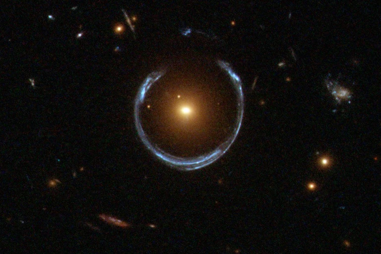 A semi-circular blue glow with a warm orange light source in the centre.