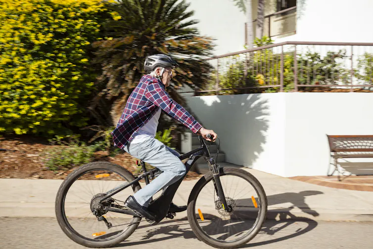 older man on e-bike