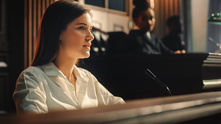 Female witness giving evidence to a court